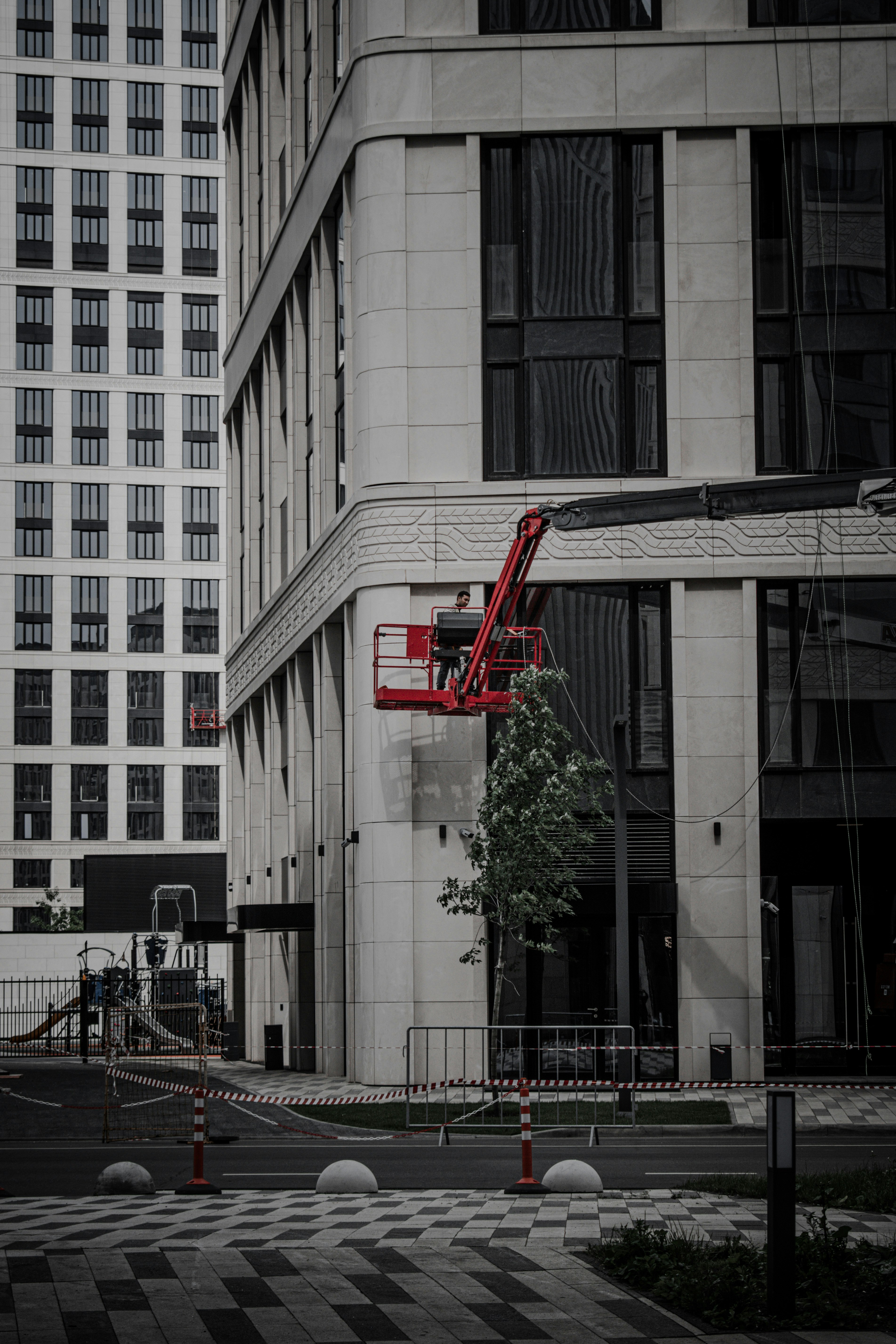 red and white building near green tree during daytime